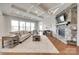 Cozy living room with a stone fireplace, coffered ceiling, and large windows at 4689 Kingswood Dr, Indian Land, SC 29707