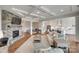 Open-concept living space featuring a fireplace, playroom, and gourmet kitchen at 4689 Kingswood Dr, Indian Land, SC 29707