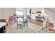 Playroom space with toys, a rug, and an open view of the living area and staircase at 4689 Kingswood Dr, Indian Land, SC 29707