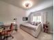 Bright bedroom featuring a daybed, ceiling fan, and a desk area for studying or working at 4715 Lenden Hall Ct, Gastonia, NC 28056