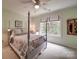 Bedroom with a four-poster bed, ceiling fan, and neutral decor at 4715 Lenden Hall Ct, Gastonia, NC 28056
