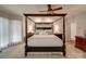 The spacious bedroom features a four-poster bed, ceiling fan, and neutral decor at 4715 Lenden Hall Ct, Gastonia, NC 28056
