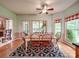 Inviting breakfast area with a view to the porch, large windows, and a comfortable atmosphere at 4715 Lenden Hall Ct, Gastonia, NC 28056