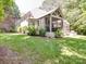 Beautiful stone home featuring a screened porch and lush landscaping at 4715 Lenden Hall Ct, Gastonia, NC 28056