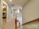 Hallway showcasing the layout of the home with access to multiple rooms and floors at 4715 Lenden Hall Ct, Gastonia, NC 28056