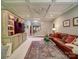 Open-concept living room with coffered ceilings, built-in shelves, and comfortable seating at 4715 Lenden Hall Ct, Gastonia, NC 28056