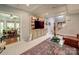 Bright living room with coffered ceilings, built-in bookshelves, and a staircase at 4715 Lenden Hall Ct, Gastonia, NC 28056