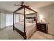 Serene main bedroom with a canopy bed, soft lighting, and a peaceful ambiance at 4715 Lenden Hall Ct, Gastonia, NC 28056