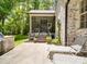 Back patio with stone grill and outdoor seating, great for entertaining and relaxation at 4715 Lenden Hall Ct, Gastonia, NC 28056