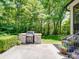 Exterior patio area with built-in grill and ample space for entertaining and backyard enjoyment at 4715 Lenden Hall Ct, Gastonia, NC 28056