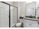 Modern bathroom featuring a walk-in shower with black trim and a vanity with a gray countertop at 5121 Ennisworth Ln, Charlotte, NC 28214