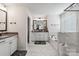 Modern bathroom featuring a large tub, a shower, and and sink vanities at 5121 Ennisworth Ln, Charlotte, NC 28214