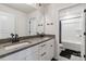 Bathroom with a double sink vanity and sleek fixtures, plus a separated toilet and shower at 5121 Ennisworth Ln, Charlotte, NC 28214