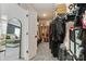 Spacious walk-in closet with ample storage and a mirror, connecting to the main bedroom at 5121 Ennisworth Ln, Charlotte, NC 28214