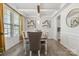 Bright dining room featuring modern light fixture, stylish decor and hardwood floors at 5121 Ennisworth Ln, Charlotte, NC 28214