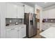 Well-equipped kitchen with stainless steel refrigerator and sleek countertops at 5121 Ennisworth Ln, Charlotte, NC 28214