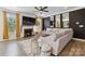 Cozy living room with fireplace, neutral decor, and plenty of natural light at 5121 Ennisworth Ln, Charlotte, NC 28214