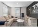 Cozy living room featuring plush sectional sofa, modern decor, and a large window at 5121 Ennisworth Ln, Charlotte, NC 28214