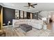 Spacious living room featuring a large white sectional sofa and modern black accent wall with decor mirrors at 5121 Ennisworth Ln, Charlotte, NC 28214