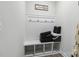 Functional mud room with bench seating, cubbies, and hooks for organized storage at 5121 Ennisworth Ln, Charlotte, NC 28214