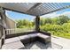 Relaxing outdoor seating area under a pergola featuring outdoor seating, and views of lush greenery at 5121 Ennisworth Ln, Charlotte, NC 28214