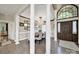 Elegant dining area showcasing hardwood floors, a decorative chandelier, columns and an open layout at 524 Wildbrook Walk, Fort Mill, SC 29708