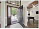 Inviting front entryway with a hardwood floor, an ornate black front door and neutral decor at 524 Wildbrook Walk, Fort Mill, SC 29708