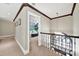 Upper hallway offers a view of downstairs living area and abundant natural light at 524 Wildbrook Walk, Fort Mill, SC 29708