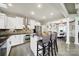 Modern kitchen boasts stainless steel appliances, granite countertops, and a breakfast bar for casual dining at 524 Wildbrook Walk, Fort Mill, SC 29708