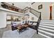 Spacious living room showcases a staircase, open floor plan, and seamless flow to the modern kitchen at 524 Wildbrook Walk, Fort Mill, SC 29708