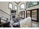 Cozy living room showcasing hardwood floors, a fireplace, and lots of natural light at 524 Wildbrook Walk, Fort Mill, SC 29708