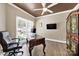 Home office featuring a ceiling fan, a large desk, a window, and hardwood floors at 524 Wildbrook Walk, Fort Mill, SC 29708