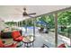 Inviting covered patio with ceiling fan, cozy seating, and a glimpse of the sparkling pool, perfect for outdoor relaxation at 524 Wildbrook Walk, Fort Mill, SC 29708