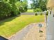 Spacious backyard features lush green grass and mature trees perfect for outdoor activities at 533 Tuckers Grove Rd, Statesville, NC 28625