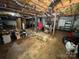 Unfinished basement featuring exposed ceiling, ductwork, concrete floor, and visible structural supports at 533 Tuckers Grove Rd, Statesville, NC 28625