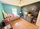 Bedroom with ceiling fan and chalk board wall at 533 Tuckers Grove Rd, Statesville, NC 28625