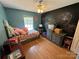 Bedroom featuring a chalkboard wall and ample natural light at 533 Tuckers Grove Rd, Statesville, NC 28625