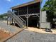 Exterior view of the home with a storage area underneath the raised porch and stairs at 533 Tuckers Grove Rd, Statesville, NC 28625