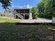 View of the backyard with a storage area underneath an elevated deck at 533 Tuckers Grove Rd, Statesville, NC 28625