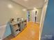 Bright hallway with access to bedrooms and bathroom with storage cabinet at 533 Tuckers Grove Rd, Statesville, NC 28625