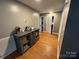 Hallway featuring hardwood floors and access to closets and bedrooms at 533 Tuckers Grove Rd, Statesville, NC 28625