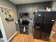 Modern kitchen showcasing dark cabinets, efficient appliances, and durable countertops, ideal for cooking and entertaining at 533 Tuckers Grove Rd, Statesville, NC 28625