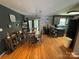 Open-concept kitchen featuring updated cabinets and hardwood floors at 533 Tuckers Grove Rd, Statesville, NC 28625