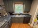 Kitchen with a double basin sink, window, and gray cabinets at 533 Tuckers Grove Rd, Statesville, NC 28625