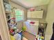 This laundry room has a window and plenty of storage for cleaning and laundry supplies at 533 Tuckers Grove Rd, Statesville, NC 28625