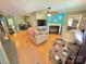 Cozy living room featuring hardwood floors, a fireplace and view into dining area at 533 Tuckers Grove Rd, Statesville, NC 28625