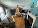 Cozy living room featuring hardwood floors, a fireplace, and modern furnishings creating an inviting and comfortable space at 533 Tuckers Grove Rd, Statesville, NC 28625
