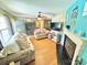 Bright living room featuring a fireplace, hardwood floors, and an open floor plan at 533 Tuckers Grove Rd, Statesville, NC 28625