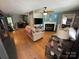 Inviting living room with hardwood floors, fireplace, and a neutral color scheme that enhances a warm and cozy atmosphere at 533 Tuckers Grove Rd, Statesville, NC 28625