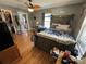 Comfortable bedroom featuring wooden floors, ample natural light, and a unique bed frame, blending style and relaxation at 533 Tuckers Grove Rd, Statesville, NC 28625